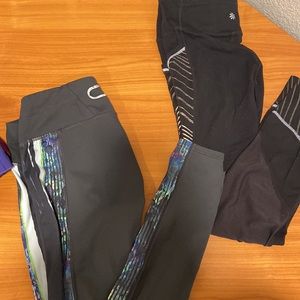 TWO black athleta leggings with colorful sides